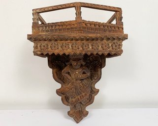 A Carved Wood Wall Shelf