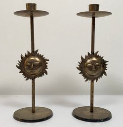 A Pair Of Brass Sun Candlesticks