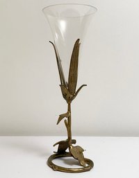 A Glass Vase With Metal Base