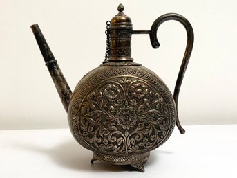 An Antique Repousse Metal Tea Pot