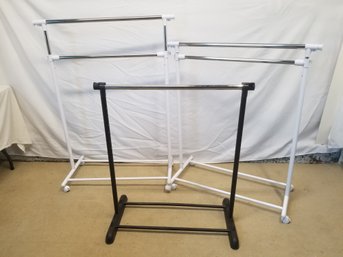 Trio Of Adjustable Height Clothing Racks Two With Locking Wheels