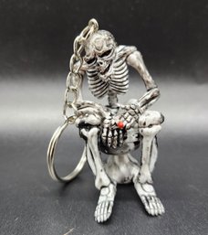 Skeleton Smoking A Cigarette On A Toilet Keychain