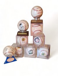 Collection Of Plastic Cased Facsimile Signatures Signed And/or Team Baseballs