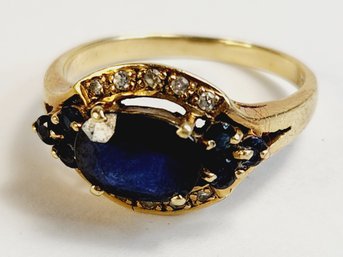 Beautiful 14k Yellow Gold Diamond Studded Dark Blue Stone Ring