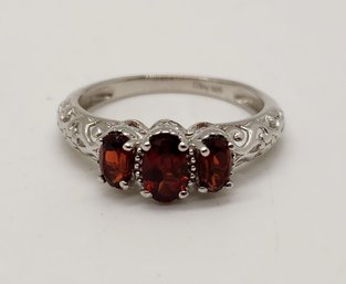 Red Garnet 3 Stone Ring In Platinum Over Sterling