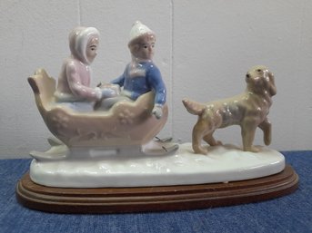 Meico Inc Hand Crafted Figurine- Kids With A Dog Sled