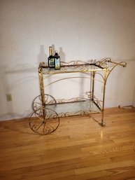 Iron Bar Cart With A Copper Finish. Glass Shelves And 3 Bottle Rack. -- - - - - - - - - - - - - - Loc: Garage