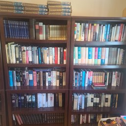 Two Full Bookshelves With An Eclectic Mix Of Books Plus Two More Book Shelves