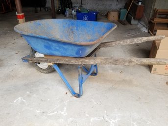 Wheelbarrow With Tire That Needs Air