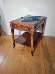 Solid Mahogony End Table On Caster.  Drawer Works Well.