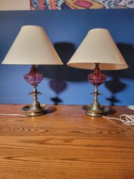 Lamp Pair.  Rose Colored Glass With Brass Base And Nice Shades. - - - - - - - - -- - - - -- -- - Loc: Closet