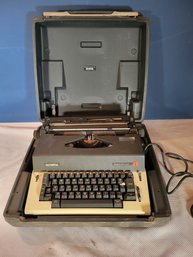 Olympia Report De Luxe Powered Typewriter.        In The Case
