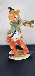 Horn Playing Ceramic Clown Sculpture