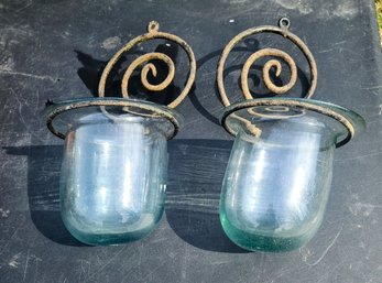 A Pair Of Vintage Tinted Glass Containers With  Cast Iron Scrolled Holderses?