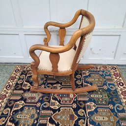 Late 19th Century Carved Blonde Oak Clawfoot Rocker With Nailhead Upholstery