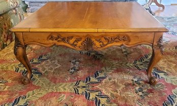 Classic Flame Maple Coffee Table With Scrolled Cabriole Legs And Carved Embellishments