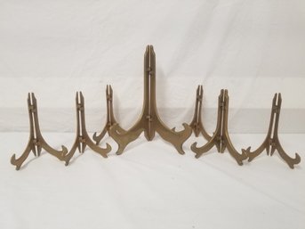 Seven Vintage Solid Brass Plate Holder Stands In Various Sizes