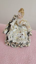 Betson's Hand Painted Porcelain Figure Of A Seated Woman