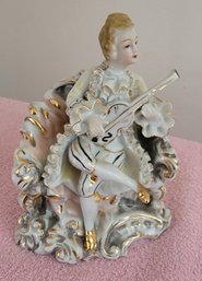 Vintage Porcelain Figure Of A Man Playing A Ululele