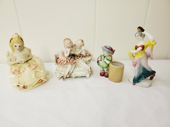 Grouping Of Four Antique Porcelain Figurines-victorian Pin Cushion Doll, Lace Girls On Sofa & More