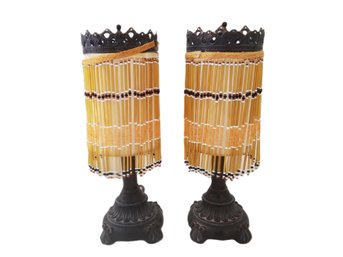 Pair Of Small Dale Lighting Resin Boudoir Lamps With Amber Beaded Tassel Shades