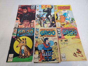 Size Assorted Comic Books - Cat Woman, GROO The Wanderer, Heathcliff, X-O Man