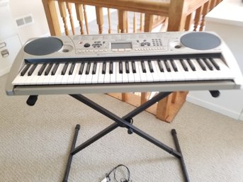 Yamaha EZ30 61-Key Portable Keyboard With Guide Lights & Folding Keyboard Stand