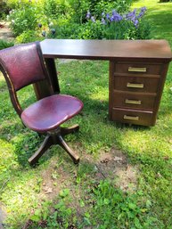 Vintage Desk And Vintage Leather Chair On Steel Base.