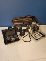 Vintage Polaroid Camera Group With Leather Camera Bag. - - - - - - - - - - - - - - - - - - - Loc: L Of S1
