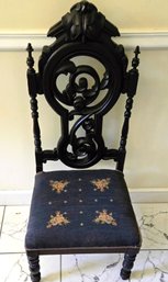 Antique Renaissance Revival Carved Formal Music Room Chair With Ebonized Finish And Needlepoint Seat