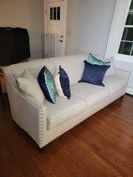 Modern Sofa Finished Is A Taupe/Silver Button Pattern.