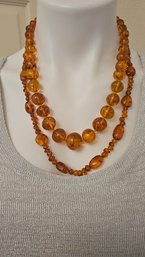 2 Very Pretty Vintage Amber Colored Riviere Beaded Necklaces Made Of Lucite?