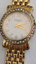 Caravelle By Bulova Gold Stainless Ladies Bracelet Clasp Watch With Zig-zag Crystal Bezel Dial