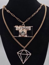 Two Black And Gold Pendant Necklaces (Camera & Diamond Shaped) With Yellow Gold Over Stainless Chains