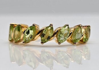 Peridot Seven Stone Ring In Yellow Gold Over Sterling