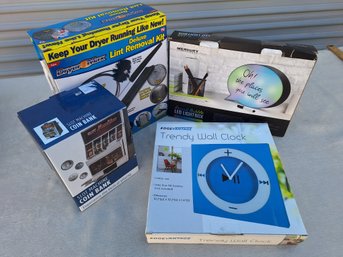 BIG LOT: CLOCK, LINT REMOVAL, LIIGHT BOX,  COIN BANK IN ORIGINAL BOXES