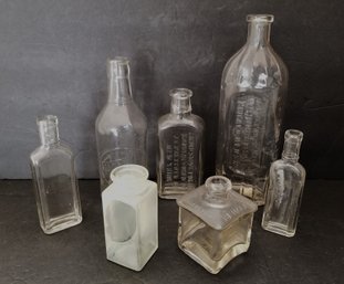 Lot Of 7 Various Size & Style Antique Embossed Bottles (lot C)