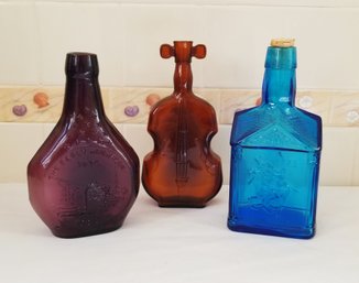 Vintage Decorative Glass Bottles: Paul Revere Liberty, Amber Cello & Early American Society (lot K)