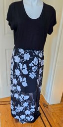 Short Sleeved Black Dress With A Sheer Overlay Skirt In White Floral Print