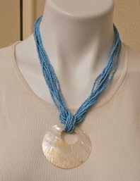 Multi-strand Turquoise Beaded Necklace With Large Mother Of Pearl Shell Pendant