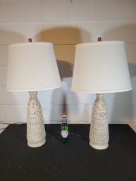 Cuneiform Lamp Pair With Elliptical Linen Shades.