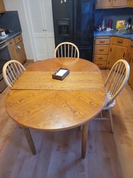 Oak Kitchen Table With 1 Leaf And 3 Chairs.