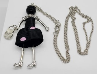 Lady Pendant Necklace With Pink Dotted Black Dress In Silvertone