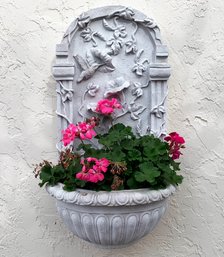 A Cast Wall Niche With Plants