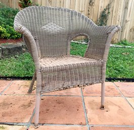 A Weathered Wicker Arm Chair