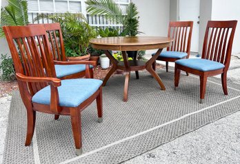 An Oak Dining Table And Set Of 4 Chairs By Ashley Furniture