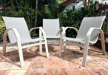 A Trio Of Outdoor Tubular Metal And Mesh Arm Chairs