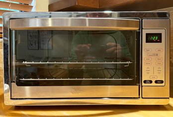 A Stainless Steel Toaster Oven By Oster