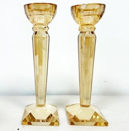 A Pair Of Vintage Faceted Amber Glass Candlesticks