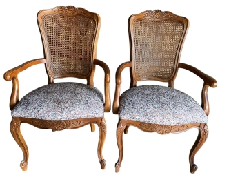 A Pair Of Cane Back Dining Chairs With Arms